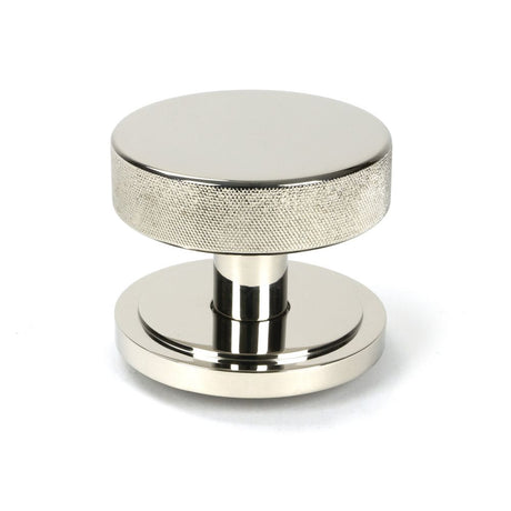 This is an image showing From The Anvil - Polished Nickel Brompton Centre Door Knob (Art Deco) available from trade door handles, quick delivery and discounted prices