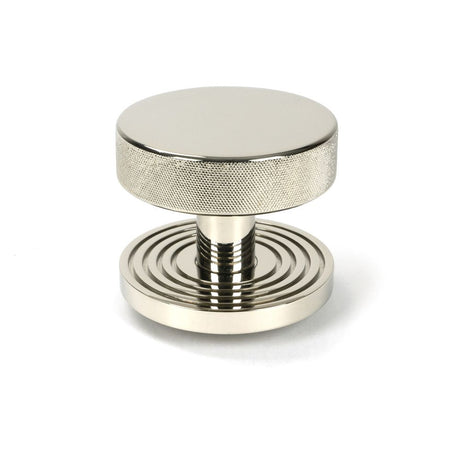 This is an image showing From The Anvil - Polished Nickel Brompton Centre Door Knob (Beehive) available from trade door handles, quick delivery and discounted prices