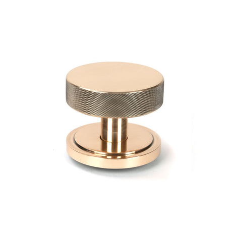 This is an image showing From The Anvil - Polished Bronze Brompton Centre Door Knob (Art Deco) available from trade door handles, quick delivery and discounted prices