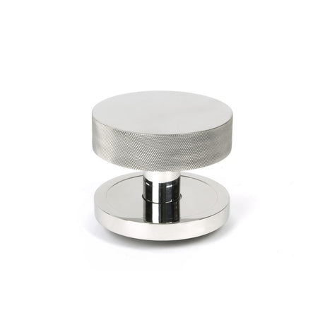 This is an image showing From The Anvil - Polished Marine SS (316) Brompton Centre Door Knob (Plain) available from trade door handles, quick delivery and discounted prices
