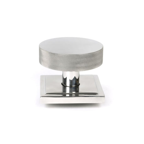 This is an image showing From The Anvil - Polished Marine SS (316) Brompton Centre Door Knob (Square) available from trade door handles, quick delivery and discounted prices
