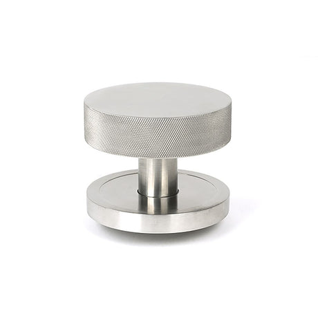 This is an image showing From The Anvil - Satin Marine SS (316) Brompton Centre Door Knob (Plain) available from trade door handles, quick delivery and discounted prices