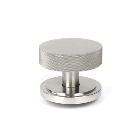 This is an image showing From The Anvil - Satin Marine SS (316) Brompton Centre Door Knob (Art Deco) available from trade door handles, quick delivery and discounted prices