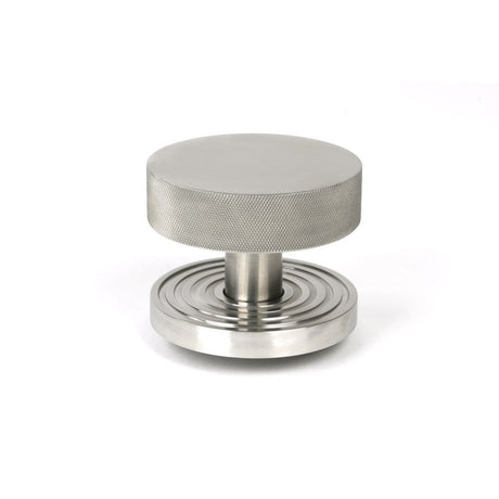 This is an image showing From The Anvil - Satin Marine SS (316) Brompton Centre Door Knob (Beehive) available from trade door handles, quick delivery and discounted prices