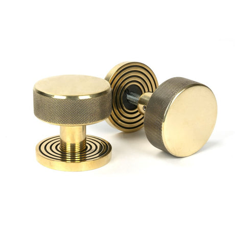 This is an image showing From The Anvil - Aged Brass Brompton Mortice/Rim Knob Set (Beehive) available from trade door handles, quick delivery and discounted prices