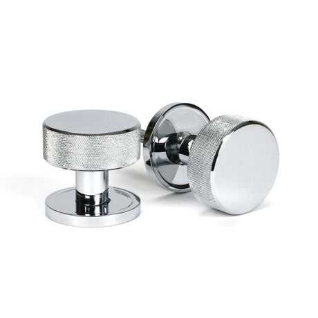 This is an image showing From The Anvil - Polished Chrome Brompton Mortice/Rim Knob Set (Plain) available from trade door handles, quick delivery and discounted prices