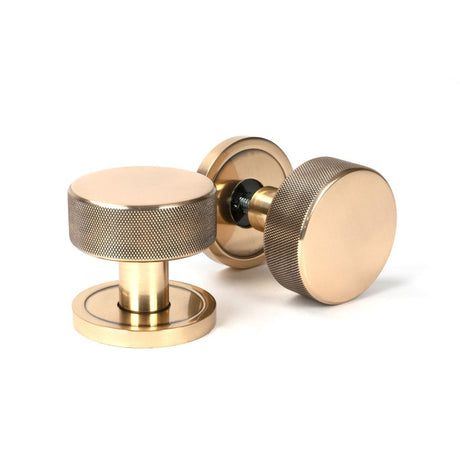 This is an image showing From The Anvil - Polished Bronze Brompton Mortice/Rim Knob Set (Plain) available from trade door handles, quick delivery and discounted prices