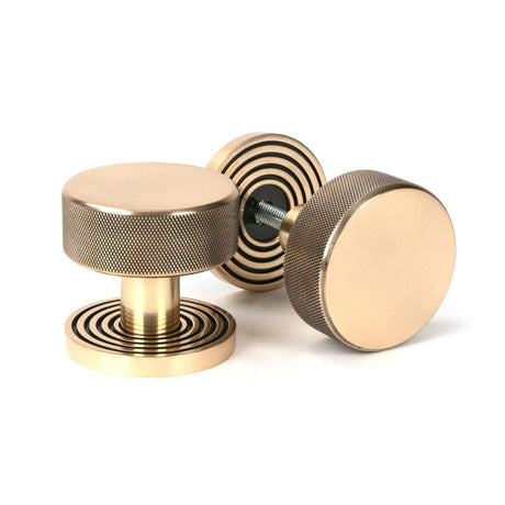 This is an image showing From The Anvil - Polished Bronze Brompton Mortice/Rim Knob Set (Beehive) available from trade door handles, quick delivery and discounted prices