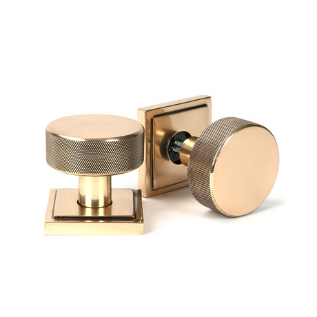 This is an image showing From The Anvil - Polished Bronze Brompton Mortice/Rim Knob Set (Square) available from trade door handles, quick delivery and discounted prices