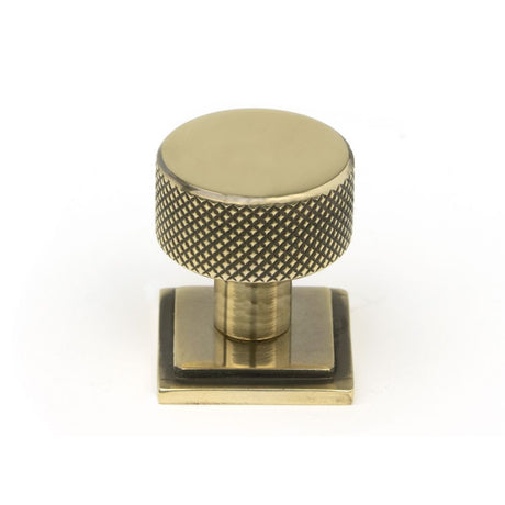This is an image showing From The Anvil - Aged Brass Brompton Cabinet Knob - 25mm (Square) available from trade door handles, quick delivery and discounted prices