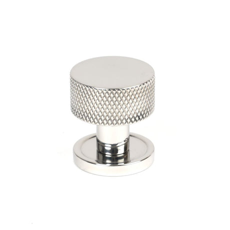 This is an image showing From The Anvil - Polished SS (304) Brompton Cabinet Knob - 25mm (Plain) available from trade door handles, quick delivery and discounted prices