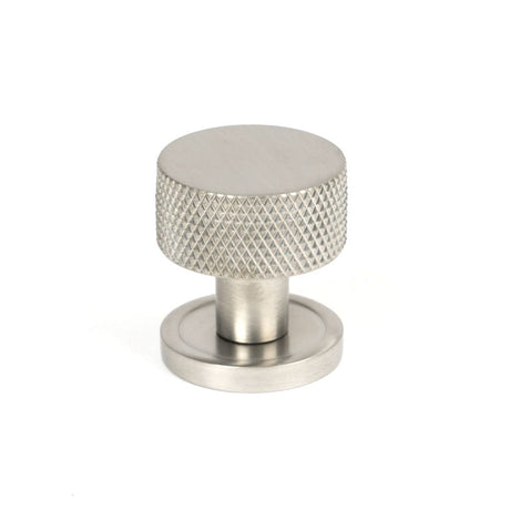 This is an image showing From The Anvil - Satin SS (304) Brompton Cabinet Knob - 25mm (Plain) available from trade door handles, quick delivery and discounted prices