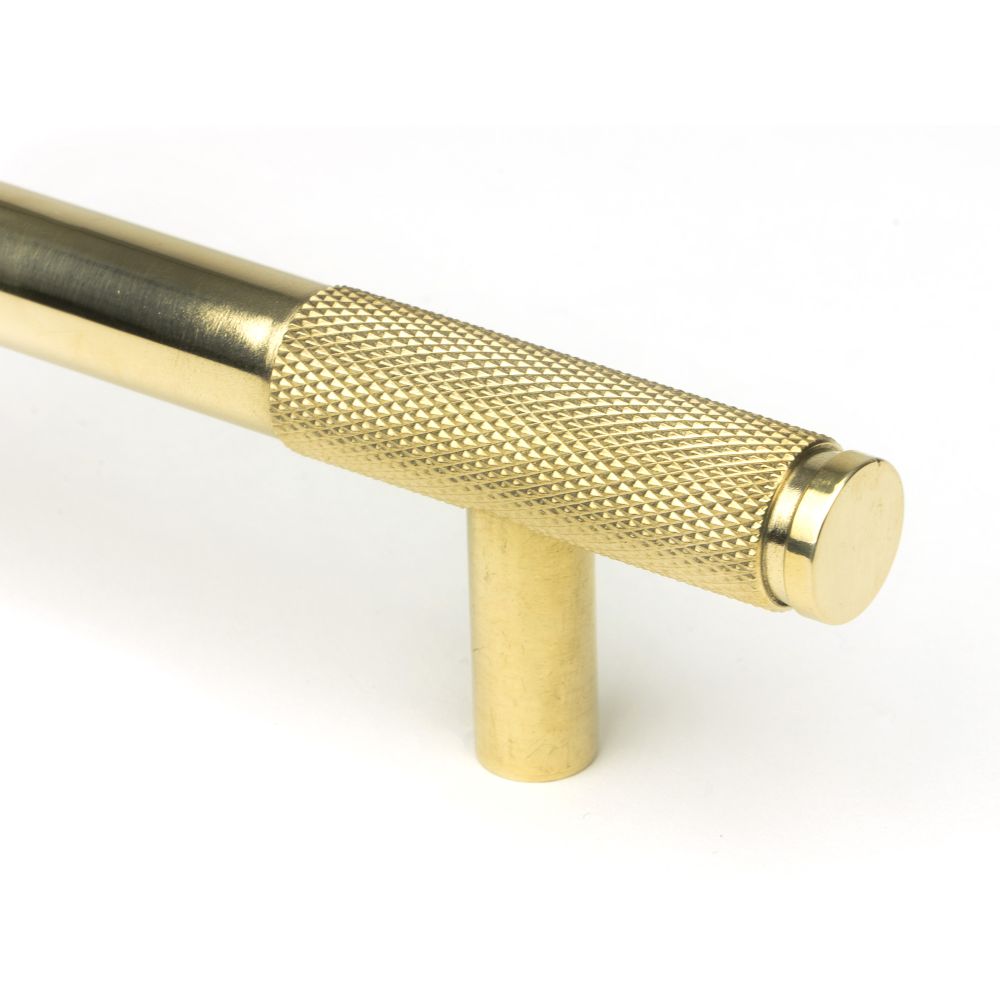 This is an image showing From The Anvil - Polished Brass Half Brompton Pull Handle - Medium available from trade door handles, quick delivery and discounted prices