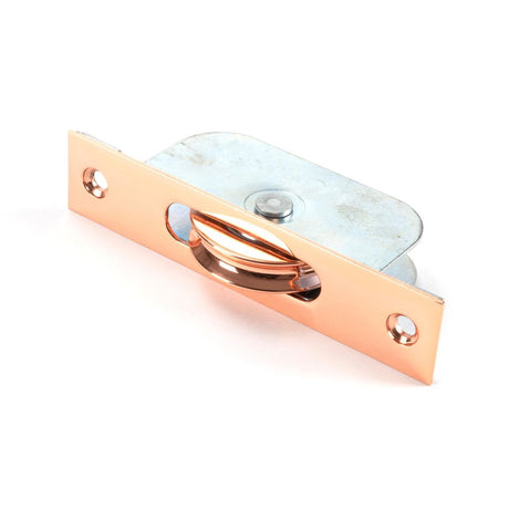 This is an image showing From The Anvil - Polished Bronze Square Ended Sash Pulley 75kg available from trade door handles, quick delivery and discounted prices