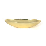 This is an image showing From The Anvil - Hammered Brass Oval Sink available from trade door handles, quick delivery and discounted prices