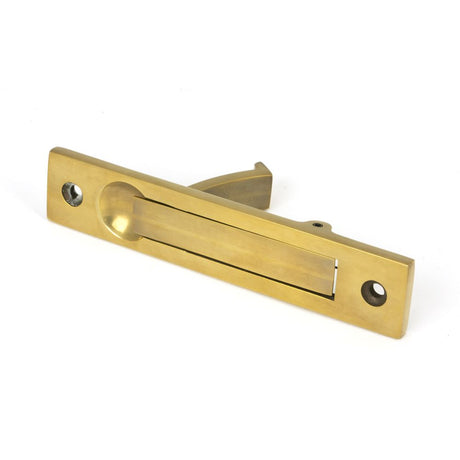 This is an image showing From The Anvil - Aged Brass 125mm x 25mm Edge Pull available from trade door handles, quick delivery and discounted prices