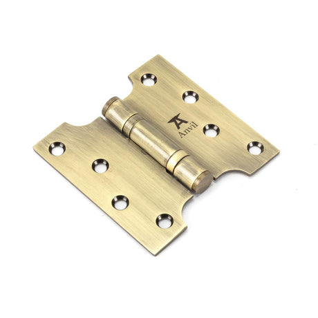 This is an image showing From The Anvil - Aged Brass 4" x 2" x 4"  Parliament Hinge (pair) ss available from trade door handles, quick delivery and discounted prices