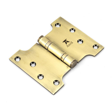 This is an image showing From The Anvil - Aged Brass 4" x 3" x 5"  Parliament Hinge (pair) ss available from trade door handles, quick delivery and discounted prices