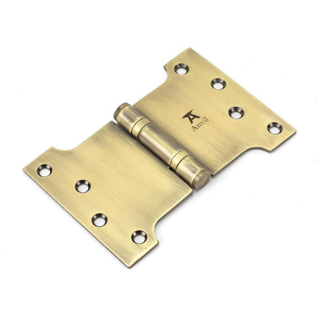 This is an image showing From The Anvil - Aged Brass 4" x 4" x 6"  Parliament Hinge (pair) ss available from trade door handles, quick delivery and discounted prices