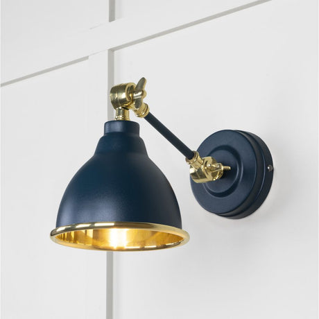 This is an image showing From The Anvil - Smooth Brass Brindley Wall Light in Dusk available from trade door handles, quick delivery and discounted prices