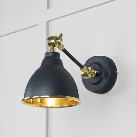 This is an image showing From The Anvil - Smooth Brass Brindley Wall Light in Soot available from trade door handles, quick delivery and discounted prices