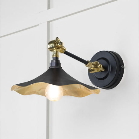 This is an image showing From The Anvil - Smooth Brass Flora Wall Light in Elan Black available from trade door handles, quick delivery and discounted prices