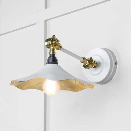This is an image showing From The Anvil - Smooth Brass Flora Wall Light in Flock available from trade door handles, quick delivery and discounted prices