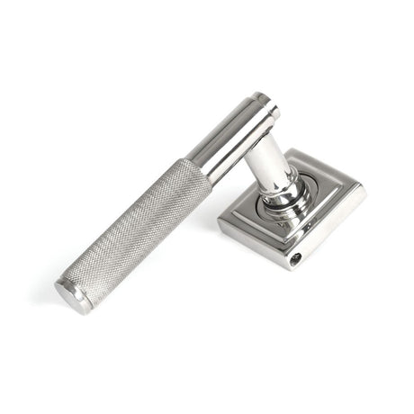 This is an image showing From The Anvil - Polished Marine SS (316) Brompton Lever on Rose Set (Square) available from trade door handles, quick delivery and discounted prices