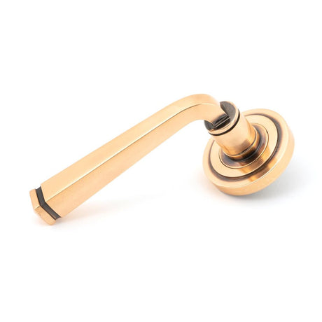 This is an image showing From The Anvil - Polished Bronze Avon Round Lever on Rose Set (Art Deco) - Unspr available from trade door handles, quick delivery and discounted prices