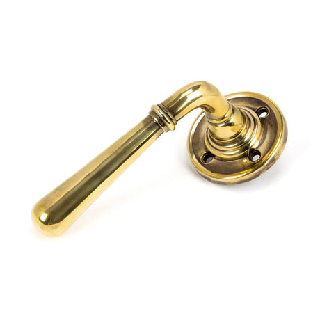 This is an image showing From The Anvil - Aged Brass Newbury Lever on Rose Set - Unsprung available from trade door handles, quick delivery and discounted prices