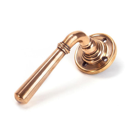 This is an image showing From The Anvil - Polished Bronze Newbury Lever on Rose Set - Unsprung available from trade door handles, quick delivery and discounted prices
