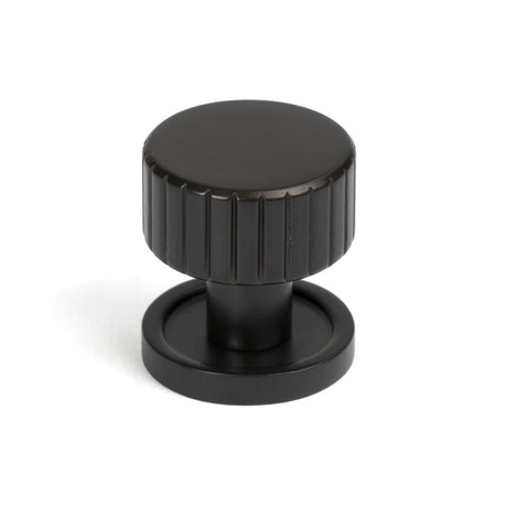 This is an image showing From The Anvil - Aged Bronze Judd Cabinet Knob - 25mm (Plain) available from trade door handles, quick delivery and discounted prices