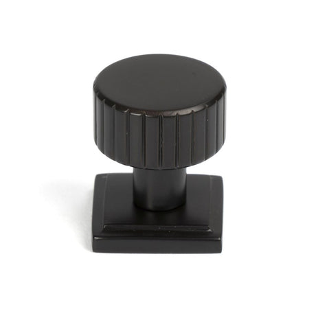 This is an image showing From The Anvil - Aged Bronze Judd Cabinet Knob - 25mm (Square) available from trade door handles, quick delivery and discounted prices