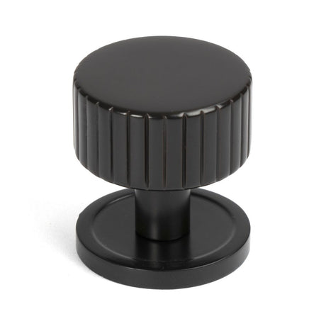 This is an image showing From The Anvil - Aged Bronze Judd Cabinet Knob - 32mm (Plain) available from trade door handles, quick delivery and discounted prices