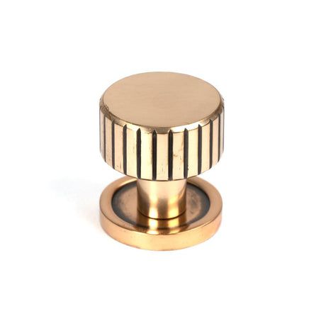 This is an image showing From The Anvil - Polished Bronze Judd Cabinet Knob - 25mm (Plain) available from trade door handles, quick delivery and discounted prices