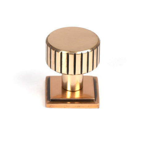 This is an image showing From The Anvil - Polished Bronze Judd Cabinet Knob - 25mm (Square) available from trade door handles, quick delivery and discounted prices