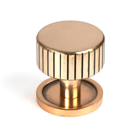 This is an image showing From The Anvil - Polished Bronze Judd Cabinet Knob - 32mm (Plain) available from trade door handles, quick delivery and discounted prices
