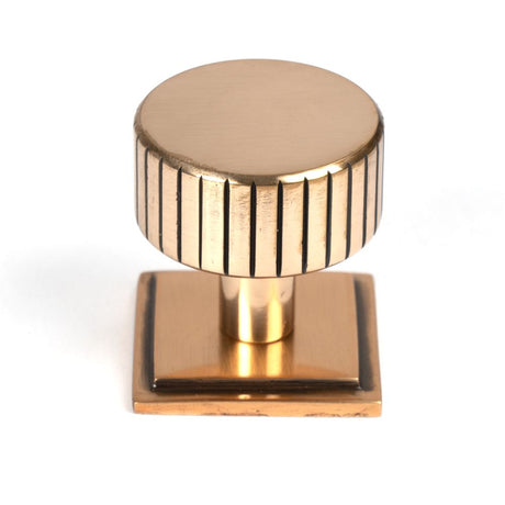 This is an image showing From The Anvil - Polished Bronze Judd Cabinet Knob - 32mm (Square) available from trade door handles, quick delivery and discounted prices