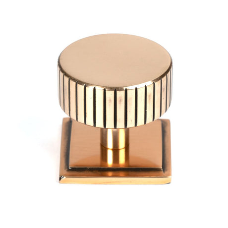 This is an image showing From The Anvil - Polished Bronze Judd Cabinet Knob - 38mm (Square) available from trade door handles, quick delivery and discounted prices