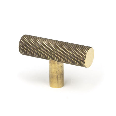 This is an image showing From The Anvil - Aged Brass Brompton T-Bar available from trade door handles, quick delivery and discounted prices