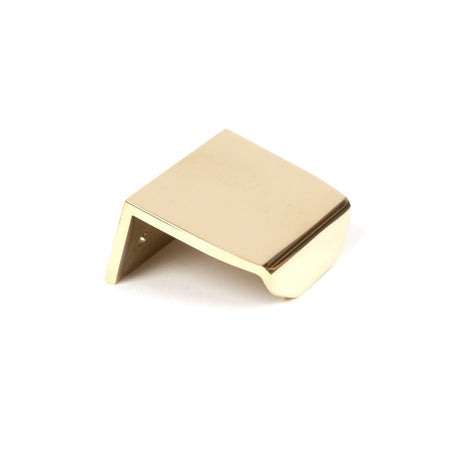 This is an image showing From The Anvil - Polished Brass 50mm Moore Edge Pull available from trade door handles, quick delivery and discounted prices