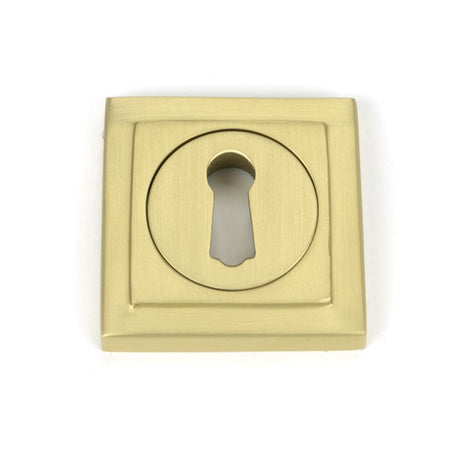 This is an image showing From The Anvil - Satin Brass Round Escutcheon (Square) available from trade door handles, quick delivery and discounted prices