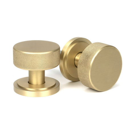 This is an image showing From The Anvil - Satin Brass Brompton Mortice/Rim Knob Set (Art Deco) available from trade door handles, quick delivery and discounted prices