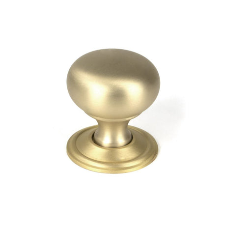 This is an image showing From The Anvil - Satin Brass Mushroom Cabinet Knob 32mm available from trade door handles, quick delivery and discounted prices