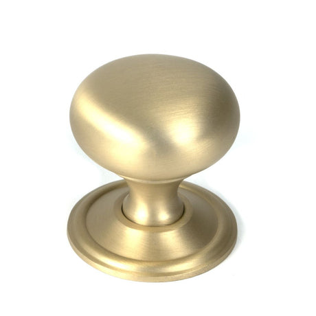 This is an image showing From The Anvil - Satin Brass Mushroom Cabinet Knob 38mm available from trade door handles, quick delivery and discounted prices