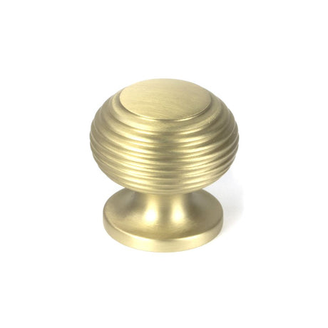 This is an image showing From The Anvil - Satin Brass Beehive Cabinet Knob 30mm available from trade door handles, quick delivery and discounted prices