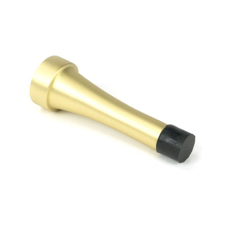 This is an image showing From The Anvil - Satin Brass Projection Door Stop available from trade door handles, quick delivery and discounted prices