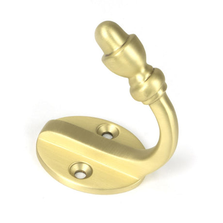 This is an image showing From The Anvil - Satin Brass Coat Hook available from trade door handles, quick delivery and discounted prices