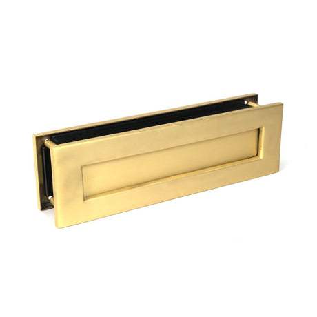 This is an image showing From The Anvil - Satin Brass Traditional Letterbox available from trade door handles, quick delivery and discounted prices