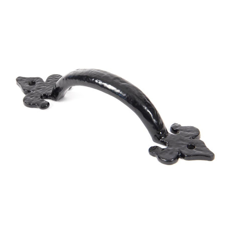 This is an image showing From The Anvil - Black Cast 6" Fleur De Lys Pull Handle available from trade door handles, quick delivery and discounted prices